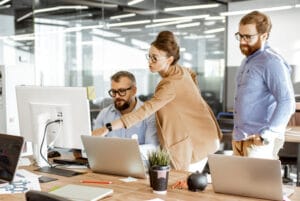 group-of-diverse-colleagues-working-on-the-computers-in-the-modern-office-or-coworking-space-bearded